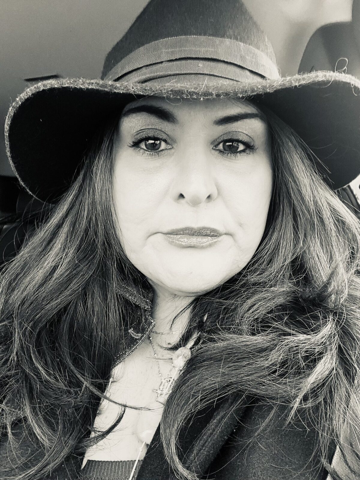Michaelle Salvador in a wide-brimmed hat, black and white